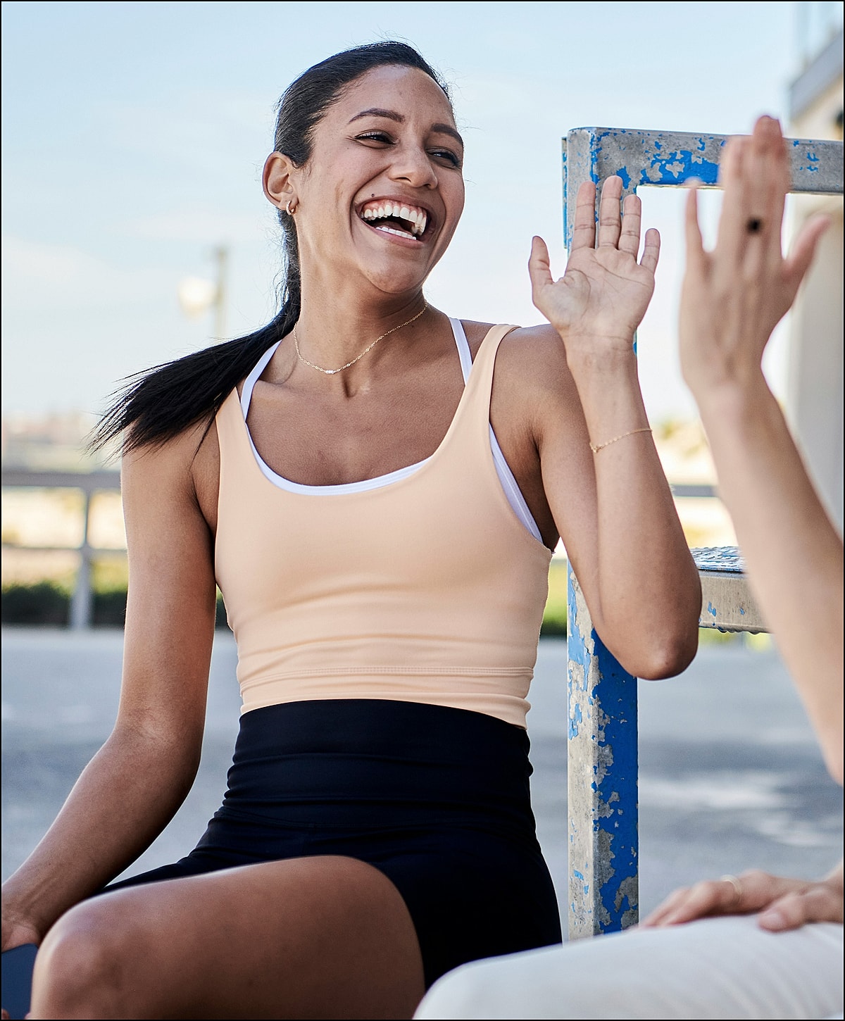 Laboratory technician holding test tubes in rack.