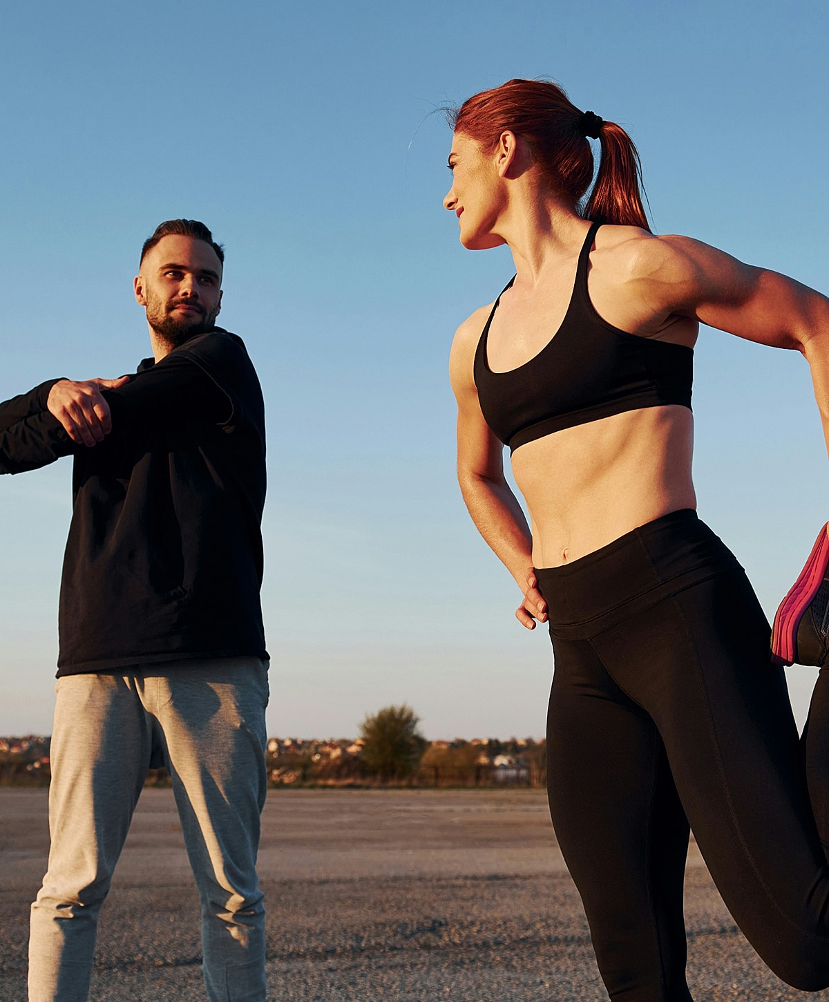 Laboratory technician holding test tubes in rack.