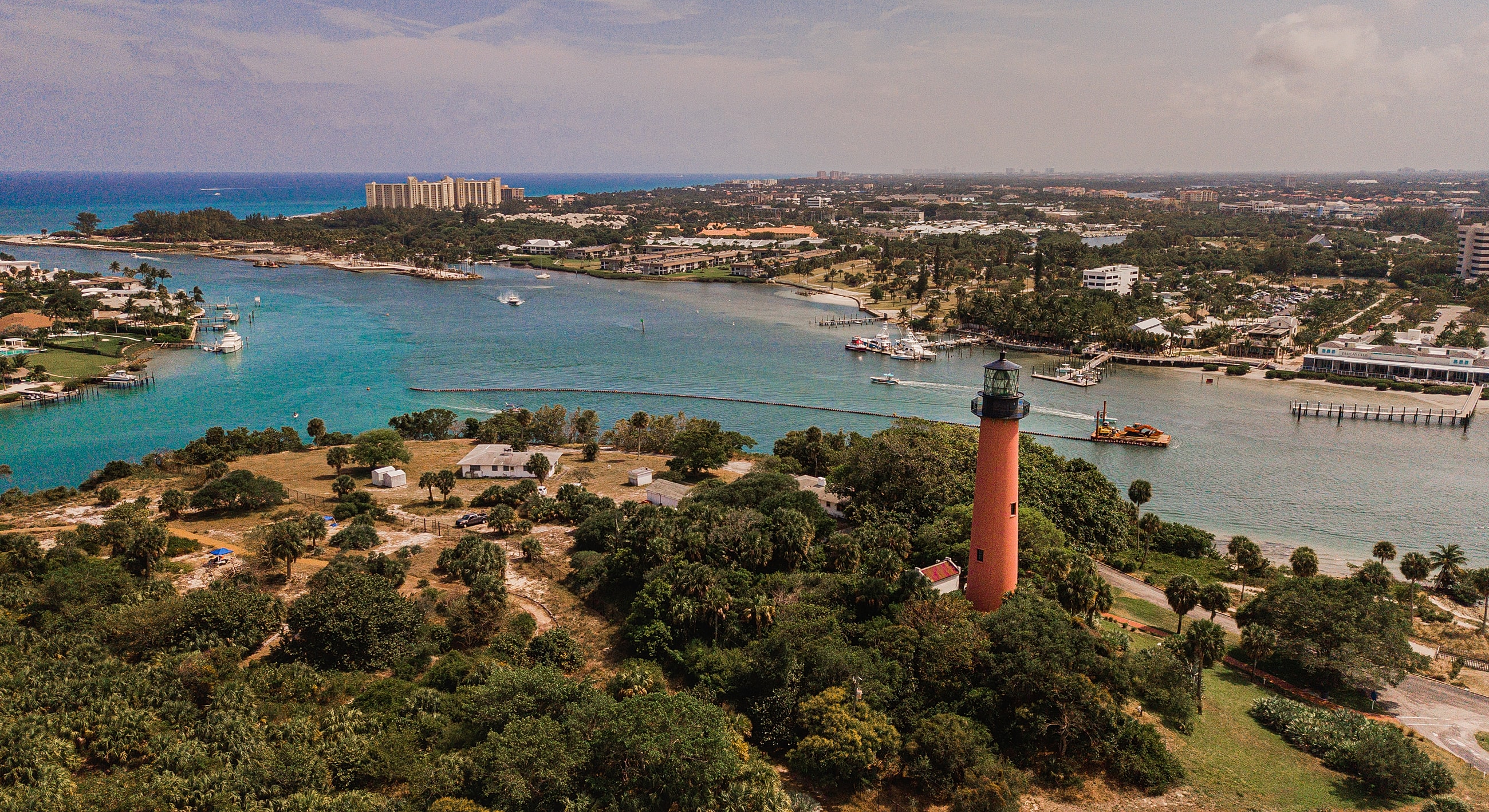 Aerial view of lighthouse by the coastline.
